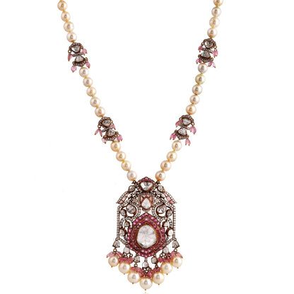 Elegant necklace with gemstones and pearls on a white background