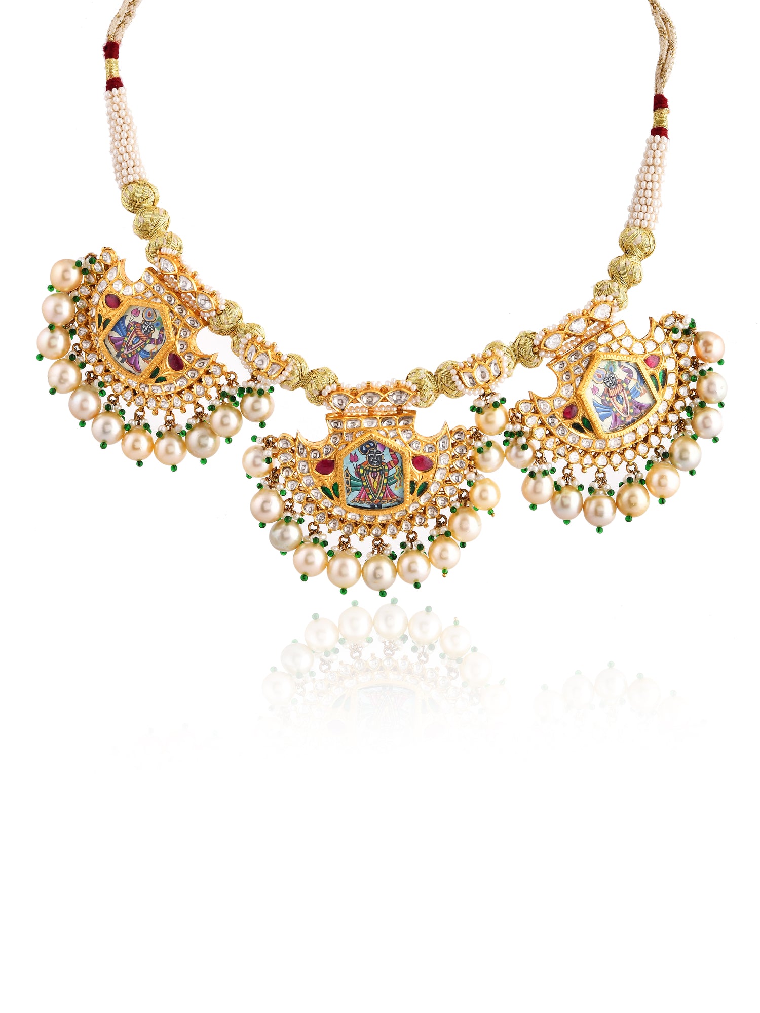 Ornate necklace with pearls and gemstones on a white background