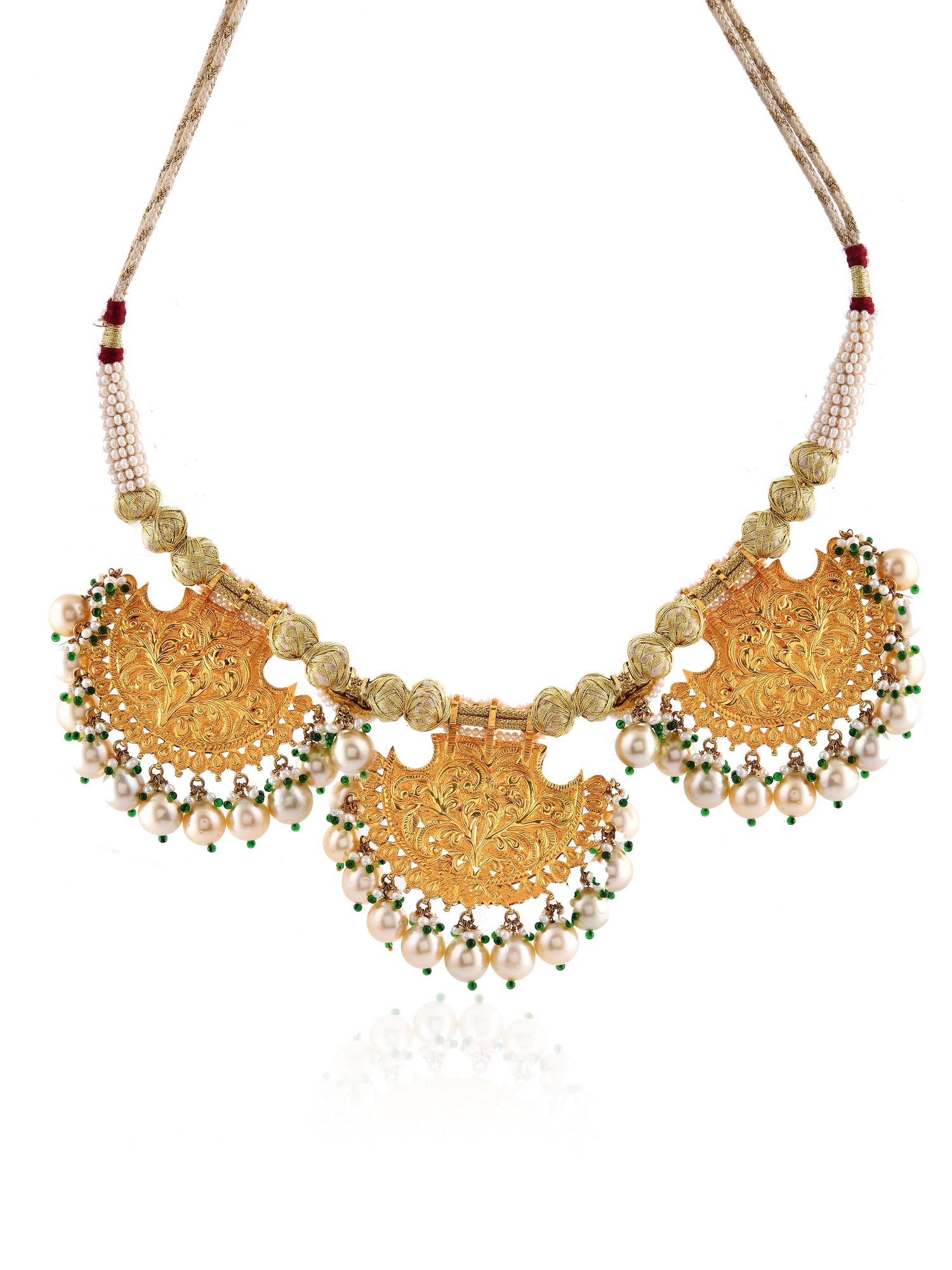 Gold necklace with circular designs and beaded accents on a white background