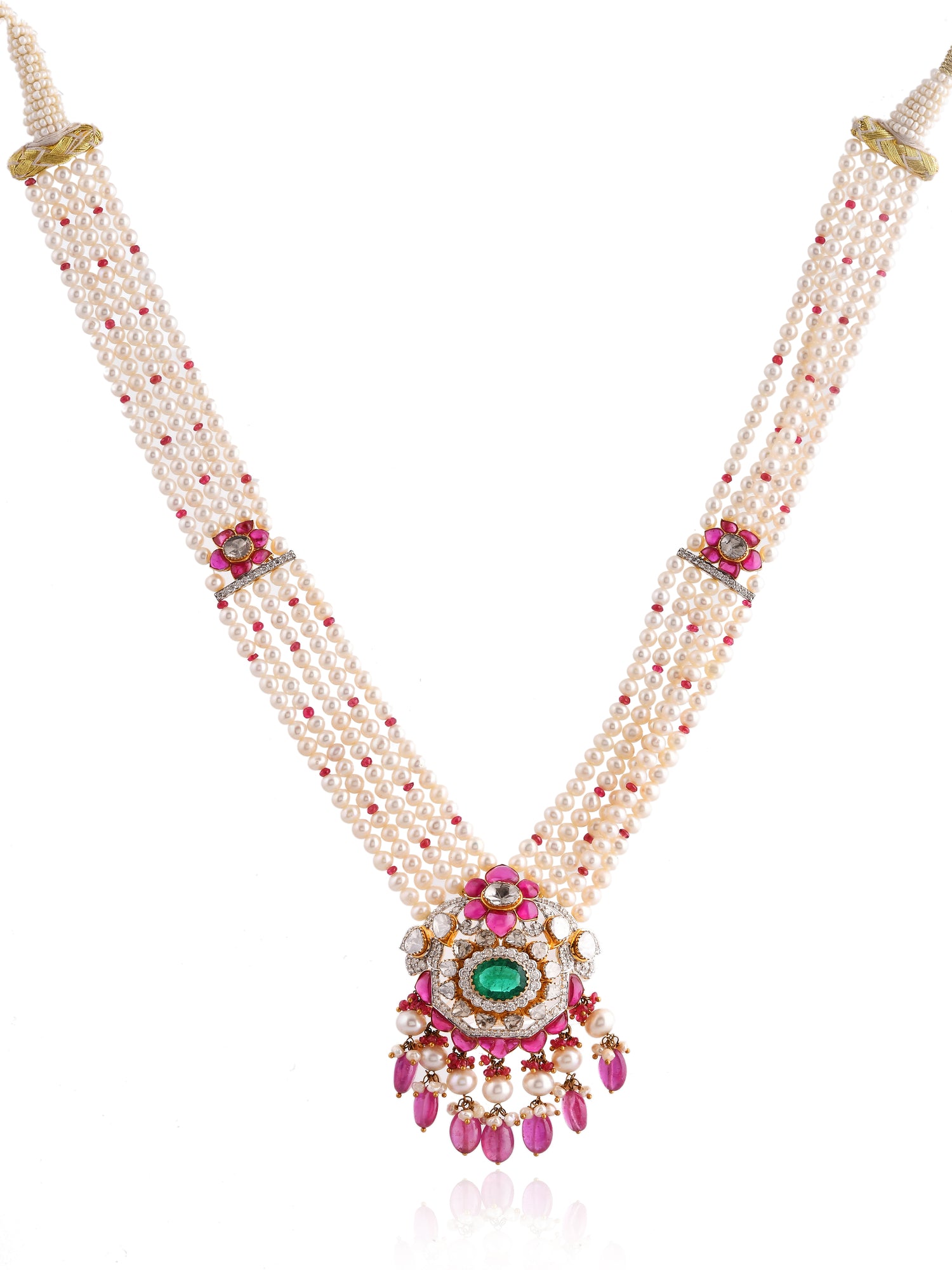 Delicate necklace with pearls, gemstones, and a central pendant on a white background