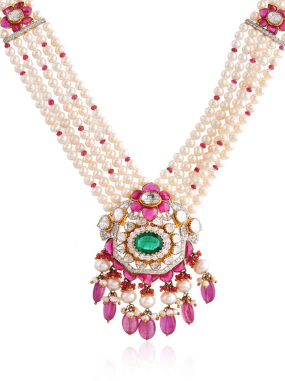 Delicate pearl necklace with pink and green gemstone pendant on a white background