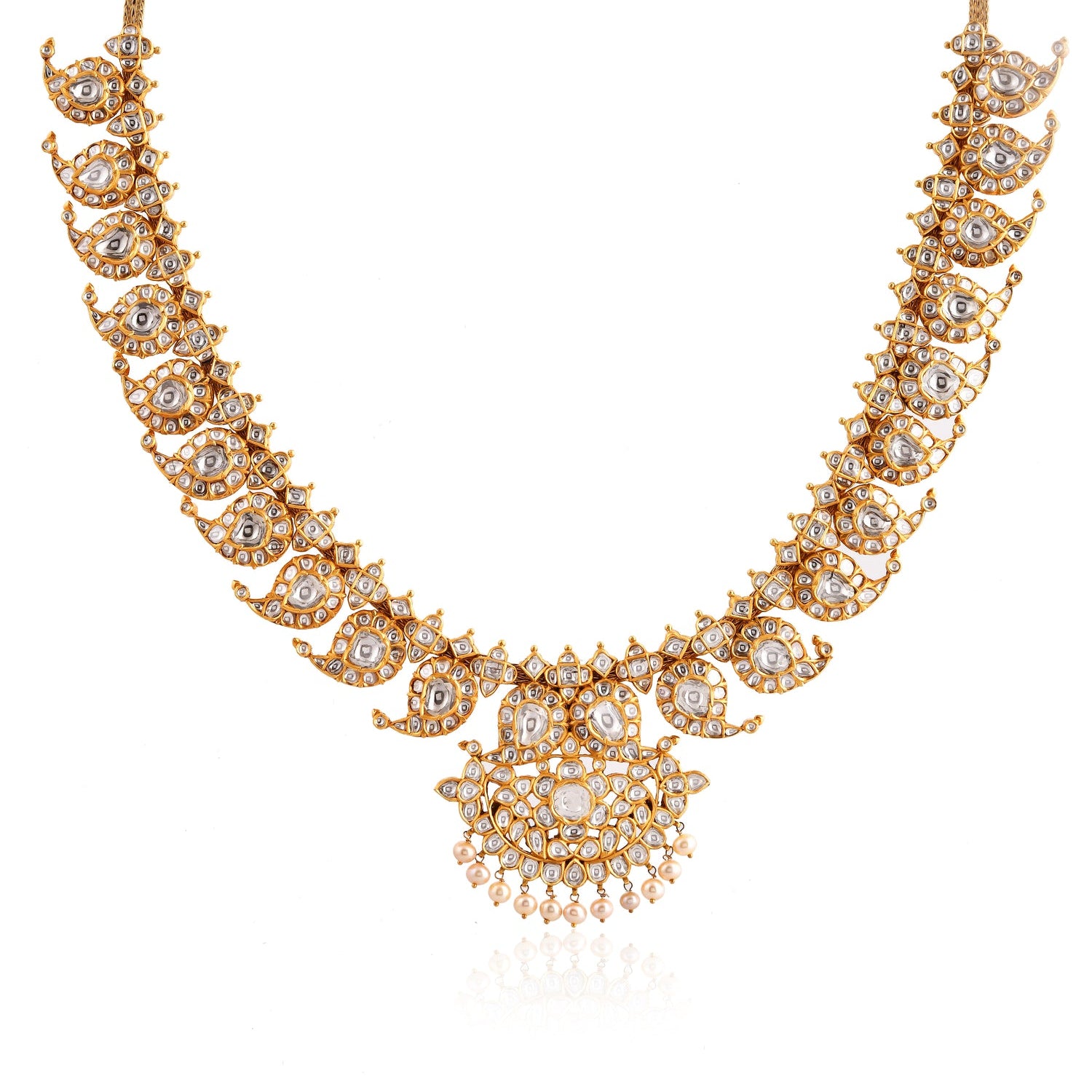 Ornate gold necklace with intricate designs on a white background