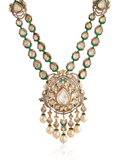 Ornate necklace with gold, green, and pearl elements on a white background