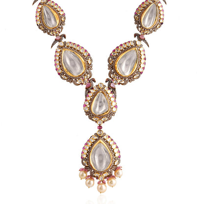 Ornate necklace with teardrop-shaped pendants on a white background