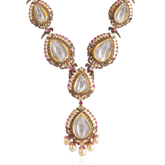 Ornate necklace with teardrop-shaped pendants on a white background