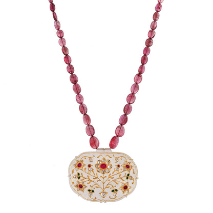 Necklace with pink beads and an ornate pendant on a white background
